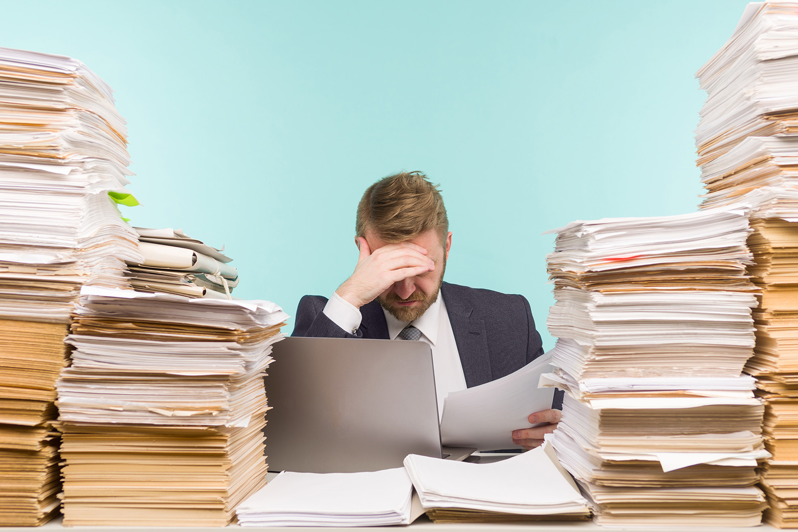 Close-up image of a stressful businessman tired from his work on the foreground
